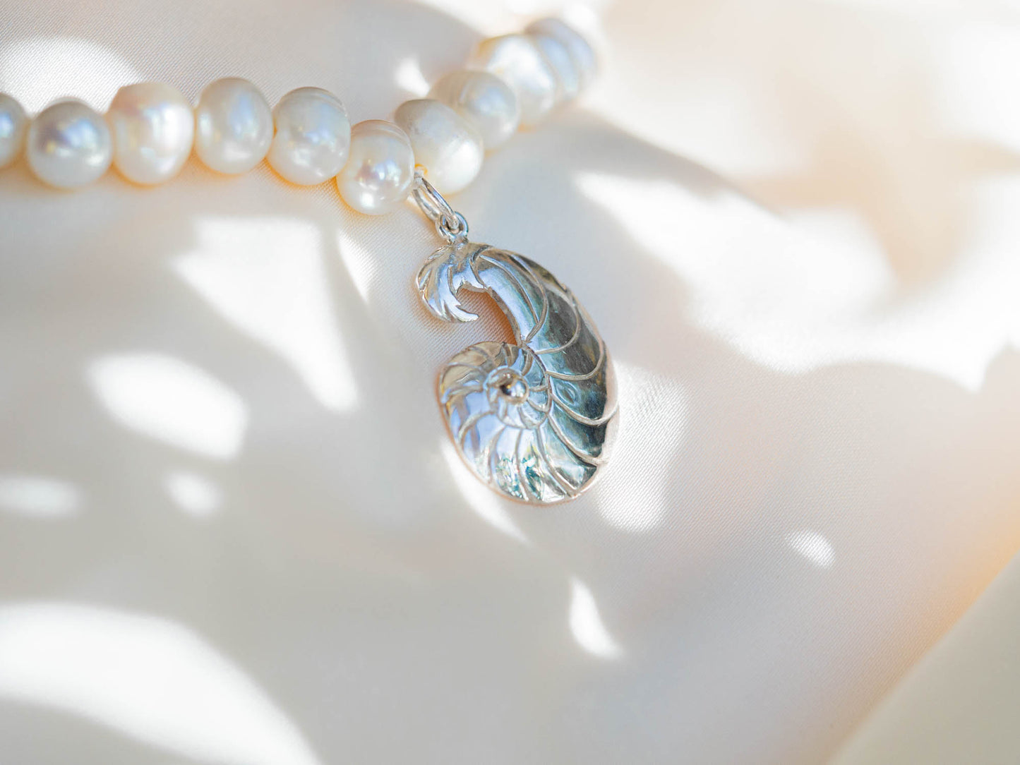Mixed Pearl and Silver Chain Necklace with Hand-Carved Nautilus Pendant